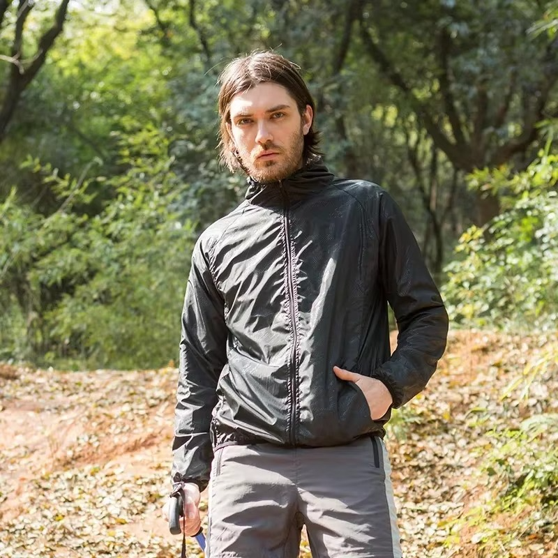 Rain Repellent Hiking Jacket with Adjustable Hood and Breathable Polyester, Packable Design for Men and Women