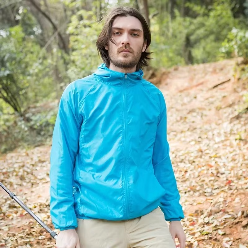 Rain Repellent Hiking Jacket with Adjustable Hood and Breathable Polyester, Packable Design for Men and Women