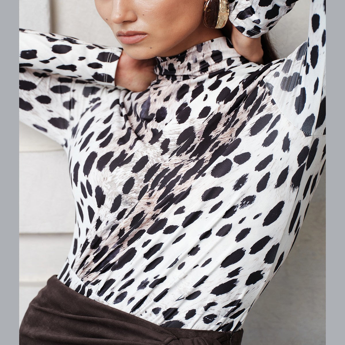 Sleeveless High Neck Bodysuit with Black and White Leopard Pattern