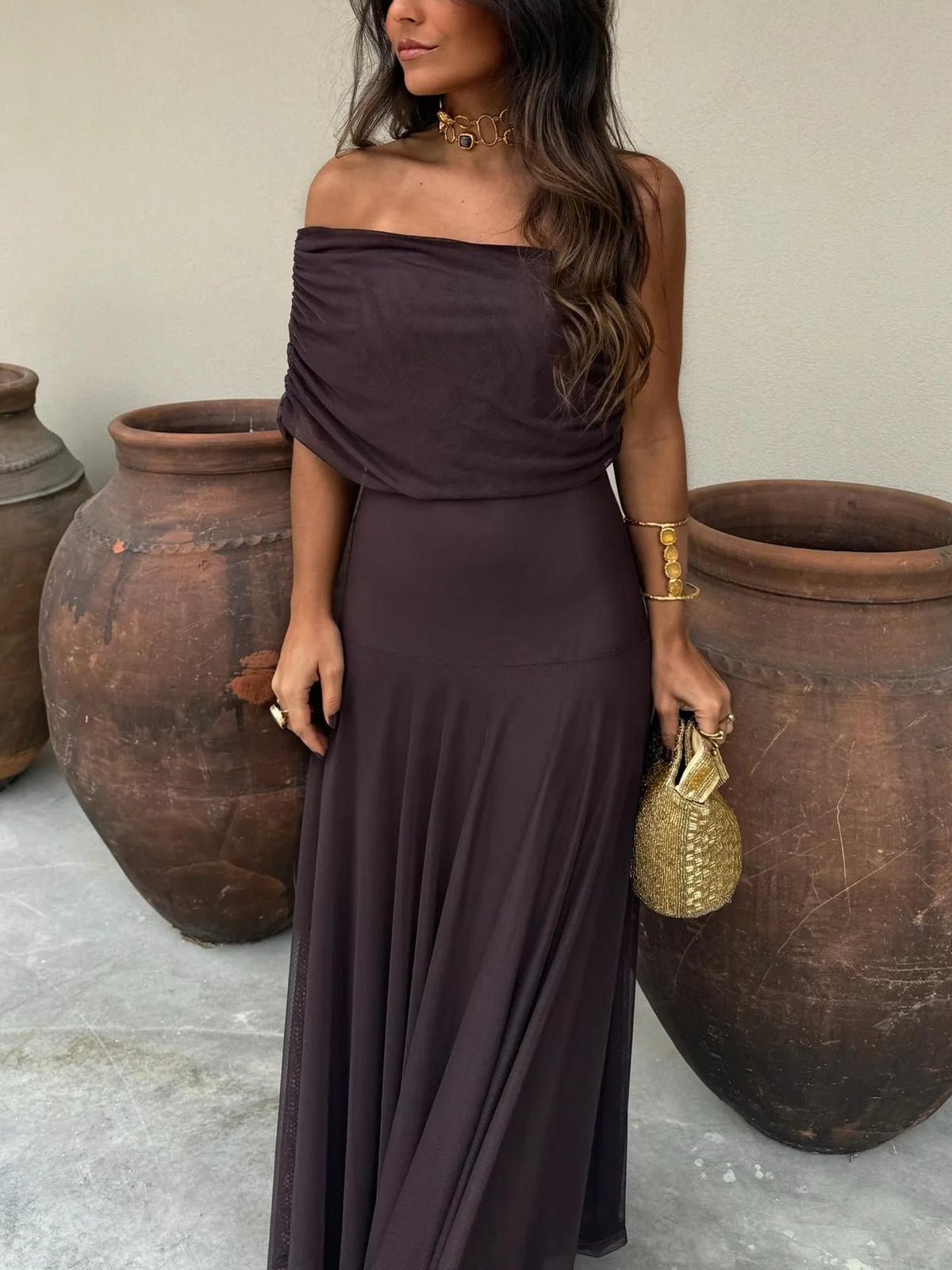 Women's elegant brown off-shoulder maxi dress, a sophisticated flowy outfit for evening parties & celebrations.