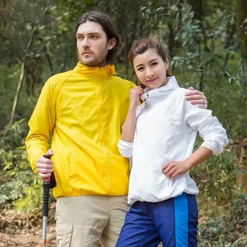 Rain Repellent Hiking Jacket with Adjustable Hood and Breathable Polyester, Packable Design for Men and Women